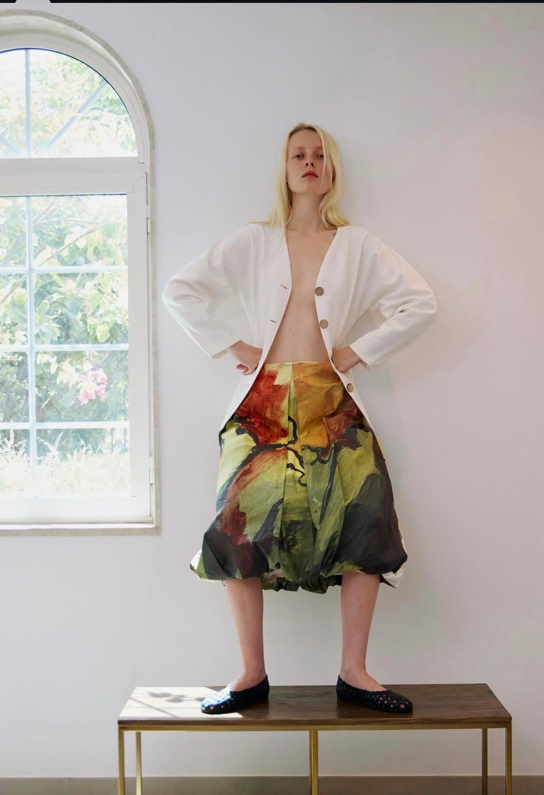 An original artwork becomes a skirt; the room becomes a gallery.